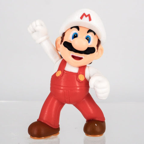 Official Super Mario Fire Mario 6cm figurine front view showing the iconic white cap and red overalls.