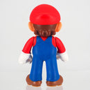 Complete unboxed Super Mario 6cm character figure standing on a clean flat surface.